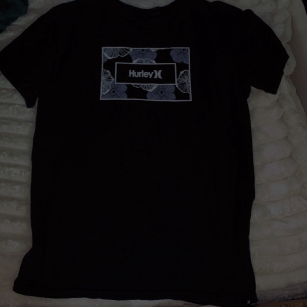 Im selling this Hurley shirt that’s black and is a women's size medium.